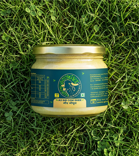 Gir Organic A2 Gir Cow Ghee jar placed on green grass